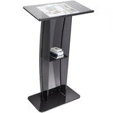 Black acrylic podium stand with a clear pulpit and integrated storage shelf.