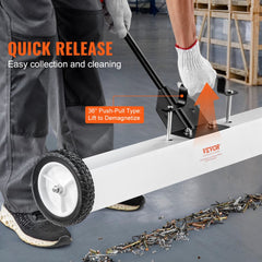A 36-inch wheeled magnetic sweeper with push-pull handle and quick-release mechanism for collecting metal debris.