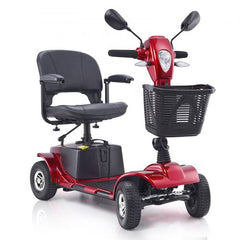 Red heavy-duty 4-wheel mobility scooter with black seat, basket, and whitewall tires.