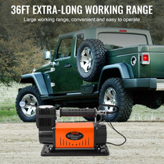 Orange Bostome 12V heavy-duty portable air compressor with 20-foot hose next to green off-road truck and large tires.