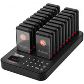 A black wireless restaurant pager system with 20 pagers charging in a base.