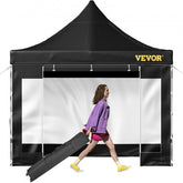 Black 10x10 pop-up canopy tent with waterproof sidewalls and adjustable heights.