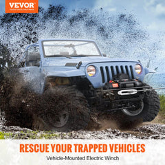 A blue Jeep with a mounted 12V 13000 lb electric winch pulling through mud on off-road terrain.