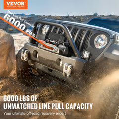 A 6000 lb electric truck winch with synthetic rope mounted on a Jeep's front bumper.