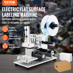 Electric flat labeling machine for boxes and bottles, labeling 25-60 per minute.