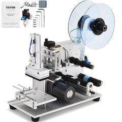 White Bostome electric flat labeling machine with label roll, accessories, and controls.