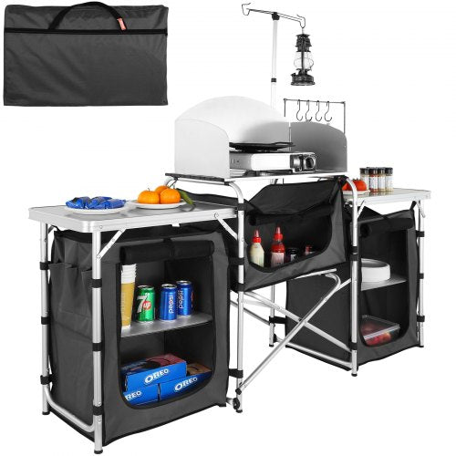 Folding aluminum camping kitchen table in black with storage shelves, bag, and lamp pole.