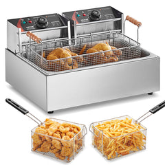 A stainless steel commercial deep fryer with two baskets containing fried chicken, shrimp, and french fries.