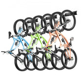 Wall-mounted bike storage rack holding six bikes in blue, green, and orange.