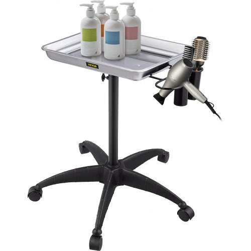 Adjustable height stainless steel salon tray on wheels with holders for bottles, hairdryer, and brush.