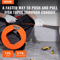 Person using 125-foot 3/16-inch orange PET fish tape to pull wire through conduit.