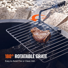 A 35-inch steel fire pit ring with a 180-degree rotatable BBQ grate holding a seared steak over flames.