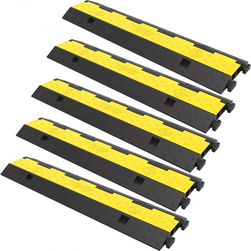 Five black and yellow rubber cable protector ramps are arranged diagonally.
