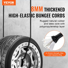 Black 32 inch heavy duty bungee cord hooked around a tire on a concrete wall background