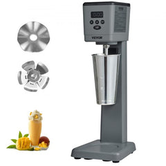 Gray Bostome electric milkshake maker with digital display, stainless steel cup, blades, and mango shake.