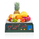 Digital price computing scale with LED display and stainless steel platform weighing assorted fruits.