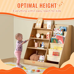 A toddler reaches for books on a 4-tier wooden kids bookshelf with sling storage pockets.