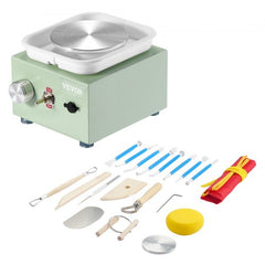 Green mini electric pottery wheel with bi-directional speed control and 16-piece tool set.