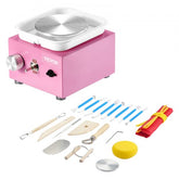 Pink mini electric pottery wheel with bi-directional speed control and included tool set.