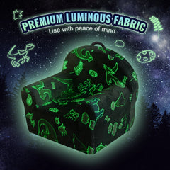 Grey toddler armchair with glow-in-the-dark fabric featuring dinosaur and fern patterns.