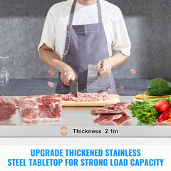 Man using a 60-inch stainless steel prep table to slice meat on a 2.1-inch thick worktop with vegetables nearby.