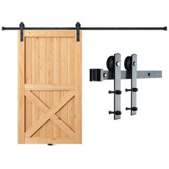 A wooden barn door with X-bracing mounted on a 10ft black I-shaped sliding track and heavy-duty rollers.