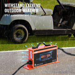 Orange 48V 15A IP67 waterproof golf cart battery charger with cables on grass near a cart in rain.