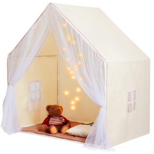 Beige yurt-style kids play tent with sheer curtains, pillow, teddy bear, and hanging lights inside.
