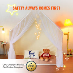 Beige yurt-style kids play tent with sheer curtains, pillows, and stuffed bear inside.