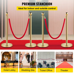 Set of four gold stainless steel stanchions with red velvet ropes for crowd control.