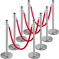 Silver crowd control stanchion set with 8 posts and 5ft red velvet ropes for event management.