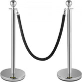 Two silver stanchions with black velvet rope connecting them for crowd control.