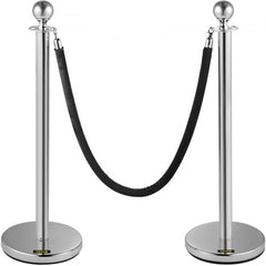 Two silver stanchions with black velvet rope connecting them for crowd control.