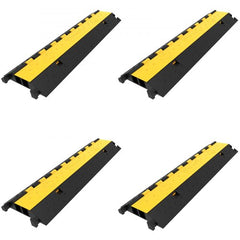 Four black and yellow 2-channel rubber cable protector ramps with 66,000 lbs capacity.