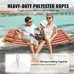 Double quilted hammock with red orange stripes and hardwood spreader bar for outdoor relaxation.