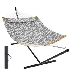 Gray quilted two-person hammock with black steel stand and wooden spreader bars.
