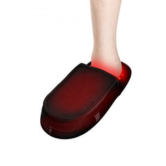 Red light therapy slipper for feet with glowing red LEDs on a person's foot.