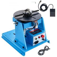 Blue Bostome rotary welding positioner with 8.1-inch 3-jaw chuck, 0-90° tilt table, foot pedal, and control box.