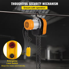 Orange electric hoist with chain, yellow emergency stop button, and limit switch for safe operation.