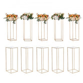 Set of 10 gold iron flower stands, 31.5 inches tall, with clear acrylic toppers for weddings.