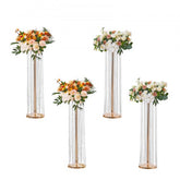 Four 35.43-inch tall metal vases with crystal gold accents for elegant floral displays.
