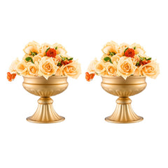 Two gold metal flower vases, each holding a bouquet of light orange and red roses.