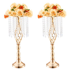 Two 21.65-inch French gold crystal flower vase stands with peach rose arrangements.