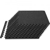 Black interlocking rubber top gym floor mats, 1/2" thick, arranged on a smooth surface.