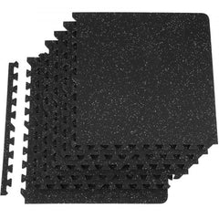 Stack of black and gray interlocking EVA foam gym floor mats, 1/2 inch thick, covering 24 sq ft.