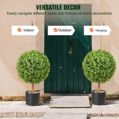 Two 40.6cm artificial boxwood topiary balls in black pots flank a green door, with decorative butterflies.