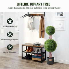 Two 3ft artificial boxwood topiary trees with double-ball design in black pots on a shelf.