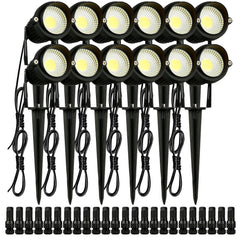 A 12-pack of black 6W LED landscape spotlights with warm white lights, stakes, and connectors.