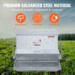 Silver galvanized steel automatic chicken feeder with 25 lbs capacity, rustproof design, and non-slip pedal on green pasture.