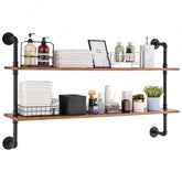 Two-tier wall-mounted industrial pipe shelf with black metal and wood boards for storage.